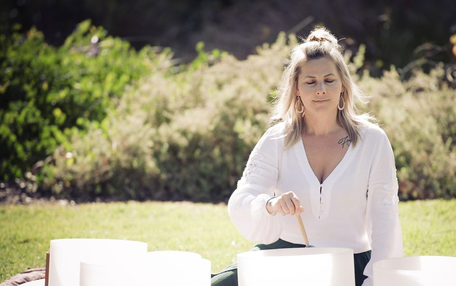 Sonja creating a sound bath with her sound bowls